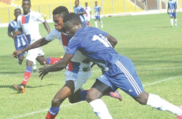 Paul Fiatsi (right) in a tussle with a Liberty player for the ball Paul Fiatsi (right) in a tussle with a Liberty player for the ball