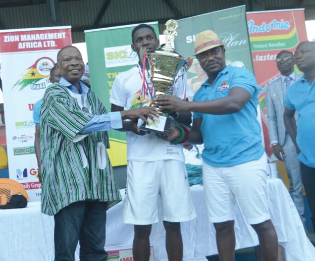 Mr Saka Acquaye of the National Sports Authority (left) and Nana Obeng Akrofi Darteh I, Baamuhene of Kwahu Mpraeso presenting a trophy to Johnson Acquah, winner of the U-18 event Mr Saka Acquaye of the National Sports Authority (left) and Nana Obeng Akrofi Darteh I, Baamuhene of Kwahu Mpraeso presenting a trophy to Johnson Acquah, winner of the U-18 event