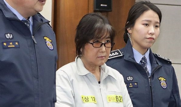 Ms Choi (centre) has been accused of bribery and corruption Ms Choi (centre) has been accused of bribery and corruption