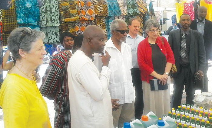 Mr Attah-Antwi (2nd left) explaining a point to Mr Annan (3rd left) at the exhibition Mr Attah-Antwi (2nd left) explaining a point to Mr Annan (3rd left) at the exhibition