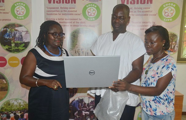 Miss Yaa Peprah Amekudzi (left) presenting the laptops to Mr Asante Lopez from the Amansie West District and Miss Josephine Biney from the Asunafo North District. Picture: Emmanuel Quaye 