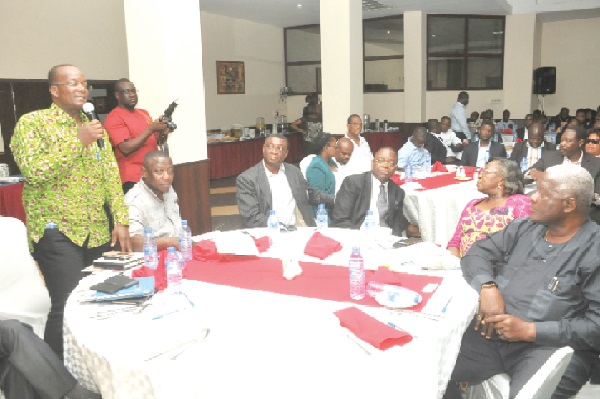 Alhaji Yahaya Yakubu (left), Director of Housing at the Ministry of Works and Housing, making a remark at the meeting. Alhaji Yahaya Yakubu (left), Director of Housing at the Ministry of Works and Housing, making a remark at the meeting.