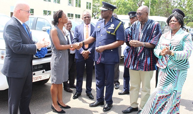 Mrs. Lopez-Ekra,presenting the keys to the vehicles to Mr David Asante-Apeatu Mrs. Lopez-Ekra,presenting the keys to the vehicles to Mr David Asante-Apeatu