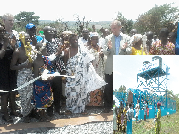 Dr Adda (4th left), Mr Strikker (3rd right) and Nene Asafoatse Obotiapong VI (middle) with elders of the town applauding after cutting a tape to inaugurate the water facility Dr Adda (4th left), Mr Strikker (3rd right) and Nene Asafoatse Obotiapong VI (middle) with elders of the town applauding after cutting a tape to inaugurate the water facility