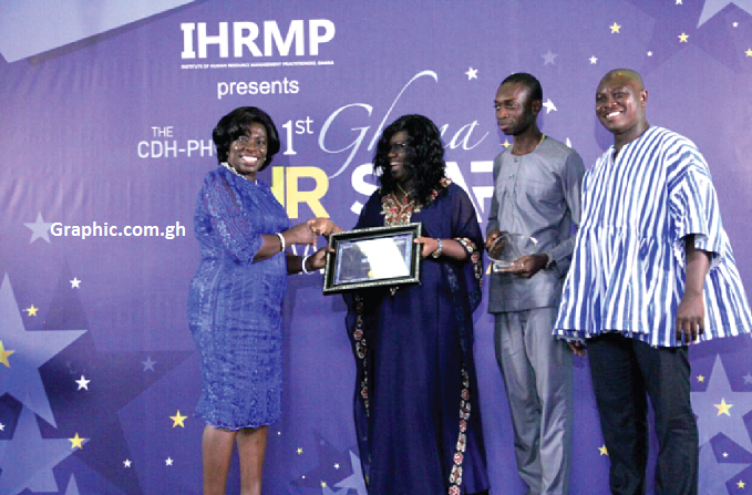 Mrs Katryn Parry (2nd right), Human Resource Operations Manager of Graphic, receiving the award from Mrs Eva Osei-Nima, a member of the National Labour Commission Mrs Katryn Parry (2nd right), Human Resource Operations Manager of Graphic, receiving the award from Mrs Eva Osei-Nima, a member of the National Labour Commission