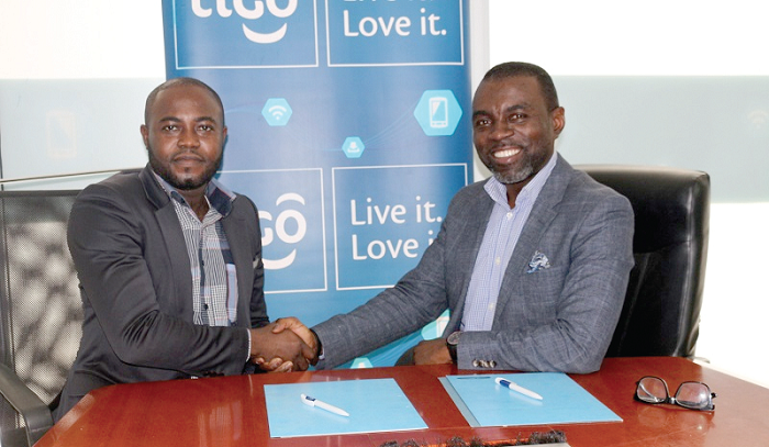 Tara Squire (right) in a handshake with Mr Bright Yeboah after the signing of the agreement Tara Squire (right) in a handshake with Mr Bright Yeboah after the signing of the agreement