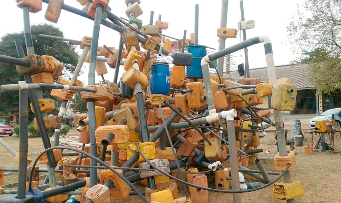 A heap of ‘Kufuor gallons’ and water pipes used by the contemporary artist to assist in demonstration A heap of ‘Kufuor gallons’ and water pipes used by the contemporary artist to assist in demonstration