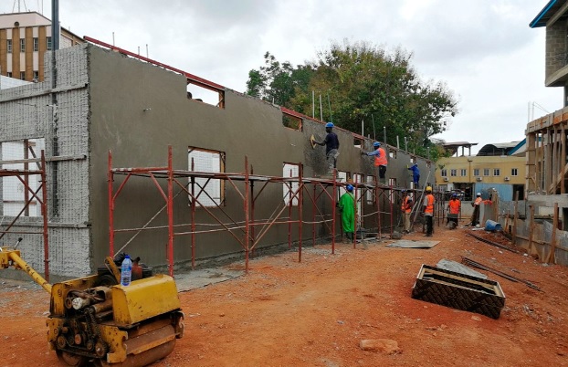 Workers busy at work to meet the deadline for the project
