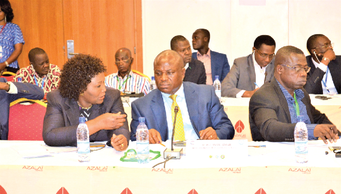 Mrs Gyebi-Donkor (left) interacting with the acting Director General of GPHA, Mr Paul Asare Ansah, at the seminar. ,oko  