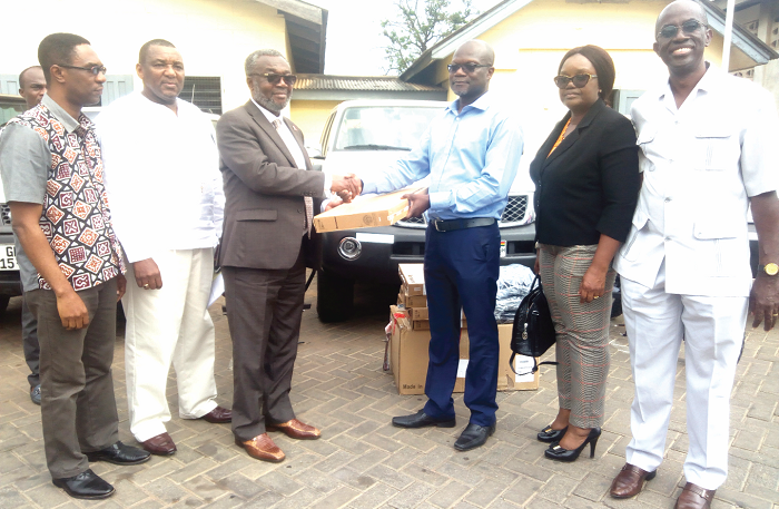 Mr Archie Laing (right) presenting the items to Dr Anthony Nsiah-Asare (left). With them are some officials of the GHS and DFID Mr Archie Laing (right) presenting the items to Dr Anthony Nsiah-Asare (left). With them are some officials of the GHS and DFID