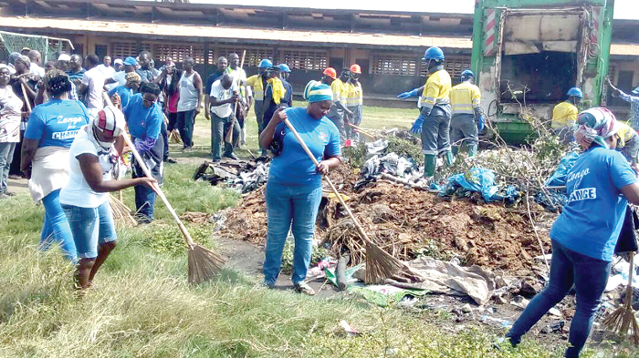 A section of residents of Community One in the clean-up exercise A section of residents of Community One in the clean-up exercise