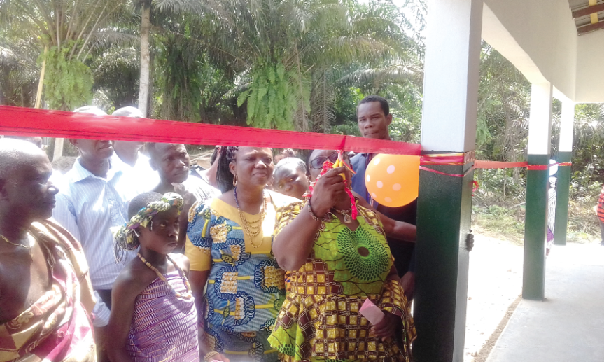Ms Victoria Addai cutting the tape for the inauguration of the building as the CRAN administrator and members of the community look on. Ms Victoria Addai cutting the tape for the inauguration of the building as the CRAN administrator and members of the community look on.