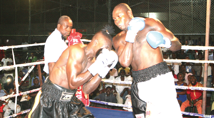 Tetteh connects a right hook to the guarded face of Kabore Tetteh connects a right hook to the guarded face of Kabore