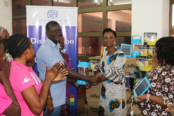 Ms Sylvia Lopez –Ekra presenting the lantern to the Kayayi