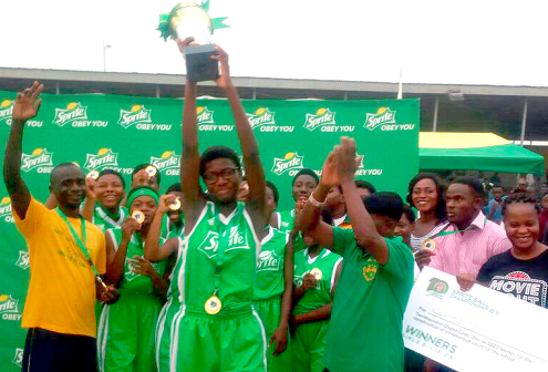 Captain of Wesley Girls’ SHS team, Miss Dorothy Kodua holds aloft the trophy the school won Captain of Wesley Girls’ SHS team, Miss Dorothy Kodua holds aloft the trophy the school won