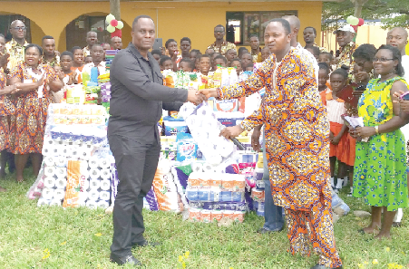 The Headmaster of the Osagyefo Leadership School, Mr Seth Korgah, presenting the items to Mr George Boakye Yiadom, the Health Service Administrator of the La General Hospital The Headmaster of the Osagyefo Leadership School, Mr Seth Korgah, presenting the items to Mr George Boakye Yiadom, the Health Service Administrator of the La General Hospital