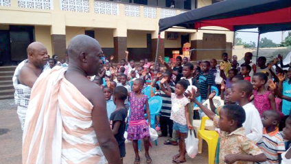 Nene Sakite II (arrowed), Konor of Manya Krobo,  with the orphans at the function      