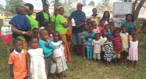 Mrs Agnes Eshun presenting the items to Mr Emmanuel Effirim, Father of Asiakwa SOS Village Mrs Agnes Eshun presenting the items to Mr Emmanuel Effirim, Father of Asiakwa SOS Village