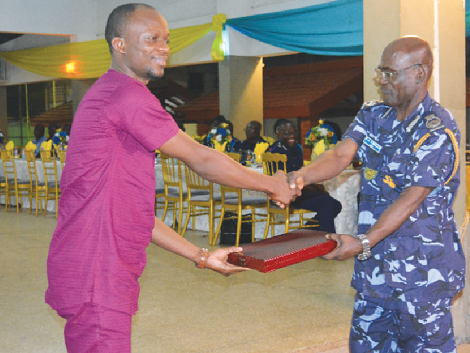 Mr Etorman Buami (left) receiving the award from Mr Frank Abban, Deputy Commissioner in charge of Preventive Mr Etorman Buami (left) receiving the award from Mr Frank Abban, Deputy Commissioner in charge of Preventive
