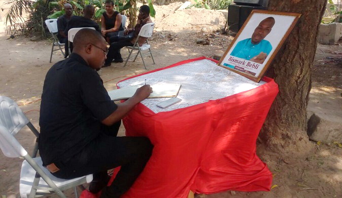 Samuel Ablordeppey, a journalist, signing a book of condolence Samuel Ablordeppey, a journalist, signing a book of condolence
