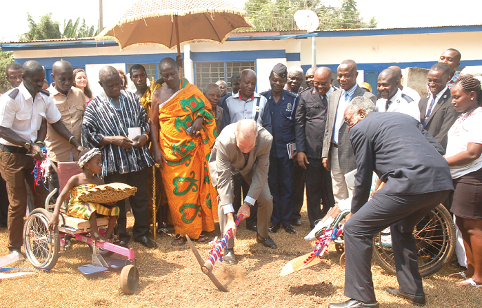 Mr Andrew Barnes (with pick axe), the Australian High Commissioner to Ghana, being assisted to cut the sod for the centre. Picture: Seth Takyi Boateng Mr Andrew Barnes (with pick axe), the Australian High Commissioner to Ghana, being assisted to cut the sod for the centre. Picture: Seth Takyi Boateng