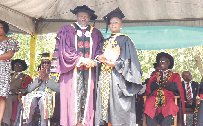 Most Rev. Titus K. Awotwi Pratt, Presiding Bishop of the Methodist Conference and Chairman of Council presenting the overall best student award to Ruby Akyere Bruce-Tagoe. PICTURE: PATRICK DICKSON Most Rev. Titus K. Awotwi Pratt, Presiding Bishop of the Methodist Conference and Chairman of Council presenting the overall best student award to Ruby Akyere Bruce-Tagoe. PICTURE: PATRICK DICKSON