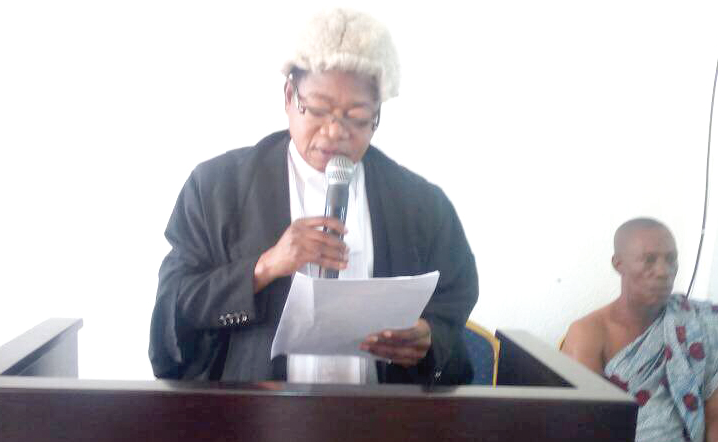 Justice William Boampong swearing in the members of the Central Regional Lands Commission