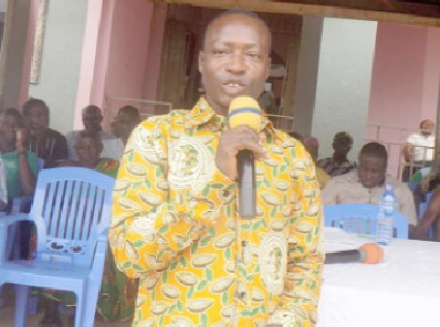 Mr Ignatius Pumpuni, the Boadua District Cocoa Officer, answering a question at the rally