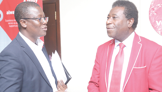 Mr Carl Ashie, Mobile Financial Service Manager, Vodafone, interacting with Prof. Pikay Richardson, Executive Education Associate, Manchester Business School, UK, after the conference