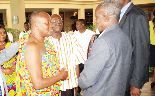 Nana Otuo Siriboe II (middle) and Mr Joseph Kofi Adda (in smock) interacting with some participants Nana Otuo Siriboe II (middle) and Mr Joseph Kofi Adda (in smock) interacting with some participants
