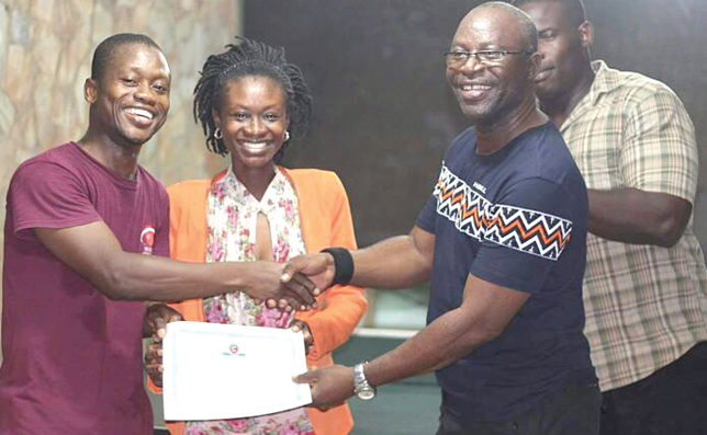 Nathaniel Kwesi Somuah (left) receiving an award from Charles Tachie Menson, team manager of Spinners Nathaniel Kwesi Somuah (left) receiving an award from Charles Tachie Menson, team manager of Spinners