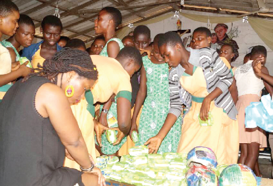 Some of the students inspecting the teaching and learning materials presented to the schools Some of the students inspecting the teaching and learning materials presented to the schools