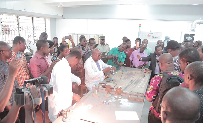 • Mr Gabriel Amo Mensah, a glass blower, demonstrating how test tubes are made • Mr Gabriel Amo Mensah, a glass blower, demonstrating how test tubes are made