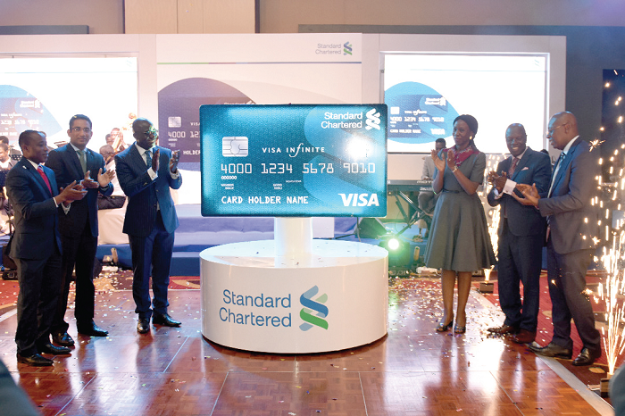 Management members of Standard Chartered unveiling the credit cards Management members of Standard Chartered unveiling the credit cards