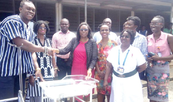 Dr Victoria May Adabayeri receiving the items from Mr Ezekiel Ansah (left) Dr Victoria May Adabayeri receiving the items from Mr Ezekiel Ansah (left)