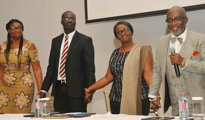 Mr Yofi Grant (right), Ms Ama Bawuah (2nd right), Senior Director of Government Relations and Mr Daniel Ababio (2nd left), an official of Ernst and Young (EY), jointly performing the official launch of Ghana Club100