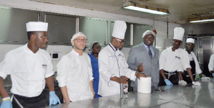 •Golden Tulip management led by Mr Marshall Otu (3rd right) addressing  the Colombian chef and the team
