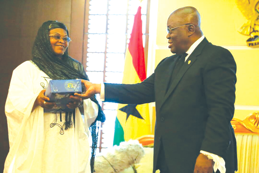 President Nana Addo Dankwa Akufo-Addo presenting a gift to Mad. Dan Nana Icha after she bid farewell to him at the Flagstaff House in Accra. Two envoys bid Prez Akufo-Addo farewell