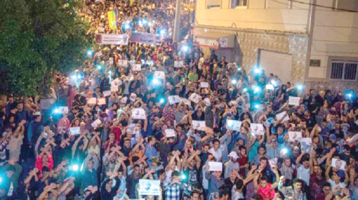Protesters in al-Hoceima held aloft pictures of Nasser Zefzafi Protesters in al-Hoceima held aloft pictures of Nasser Zefzafi