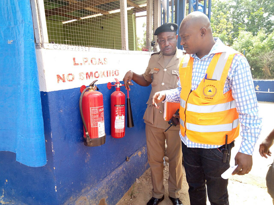 Some members of the team examining gas cylinders at one of the gas stations Some members of the team examining gas cylinders at one of the gas stations