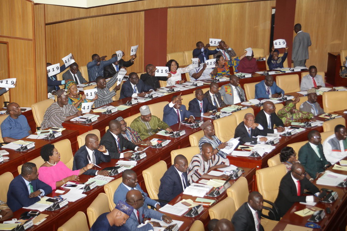Members of the Minority side displaying placards after the budget hearing Members of the Minority side displaying placards after the budget hearing