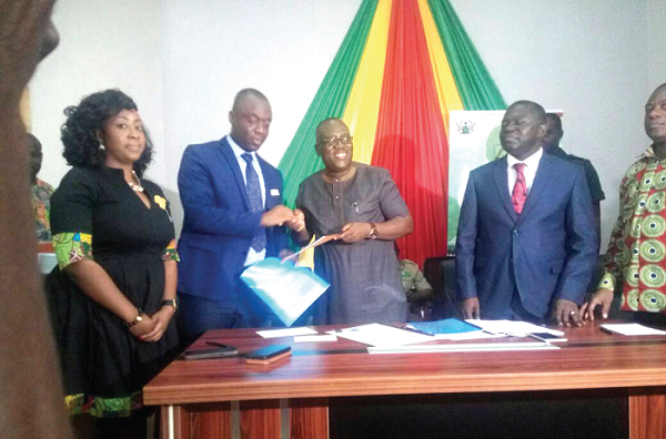The Chief Executive Officer of the Forestry Commission, Mr Kwadwo Owusu-Afriyie (2nd right), exchanging the signed agreement with the Chief Executive Offier of the National Youth Employment Agency, Mr Justine Kodua Agyeman (2nd left) while others including the Deputy Minister of Lands and Natural Resources, Mr Benito Owusu Bio look on The Chief Executive Officer of the Forestry Commission, Mr Kwadwo Owusu-Afriyie (2nd right), exchanging the signed agreement with the Chief Executive Offier of the National Youth Employment Agency, Mr Justine Kodua Agyeman (2nd left) while others including the Deputy Minister of Lands and Natural Resources, Mr Benito Owusu Bio look on