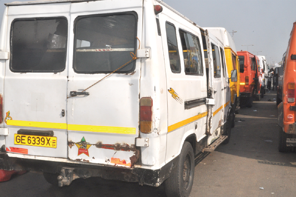 Tro-tros parked at a station waiting their turn to pick passengers Tro-tros parked at a station waiting their turn to pick passengers