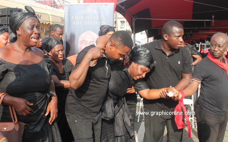 The bereaved wife, Valentina is supported by family and friends as she breaks down at the one week observation. 