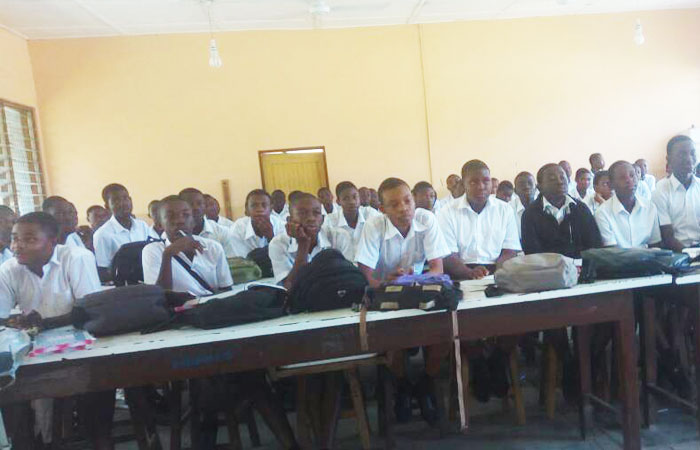Some students in a science lab which has been turned into a classroom at St Aquinas.