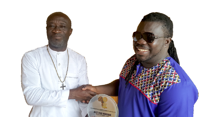 The MUSIGA president, Bike Osei Kuffour (right) receiving his award from Prince Kofi Nyantakyi The MUSIGA president, Bike Osei Kuffour (right) receiving his award from Prince Kofi Nyantakyi