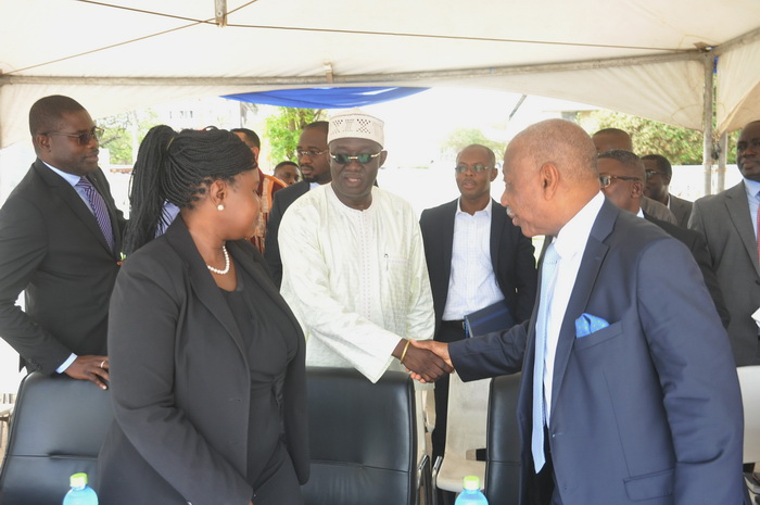 Mr Kofi Adda, Minister of Sanitation and Water Resources (middle) congratulating the management of GWCL for the initiative after the launch Mr Kofi Adda, Minister of Sanitation and Water Resources (middle) congratulating the management of GWCL for the initiative after the launch