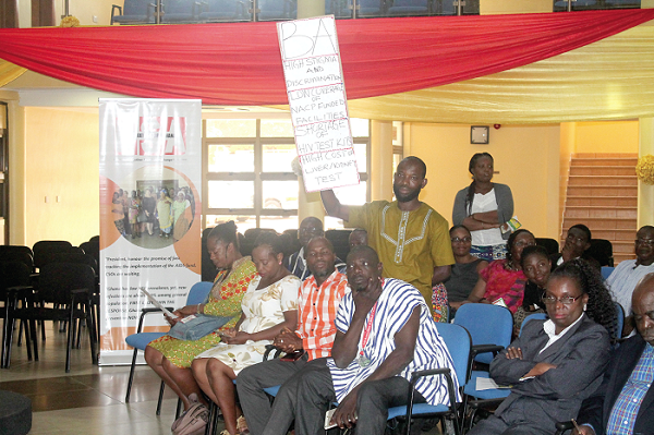A participant holding a placard during the forum. Picture: Maxwell Ocloo A participant holding a placard during the forum. Picture: Maxwell Ocloo
