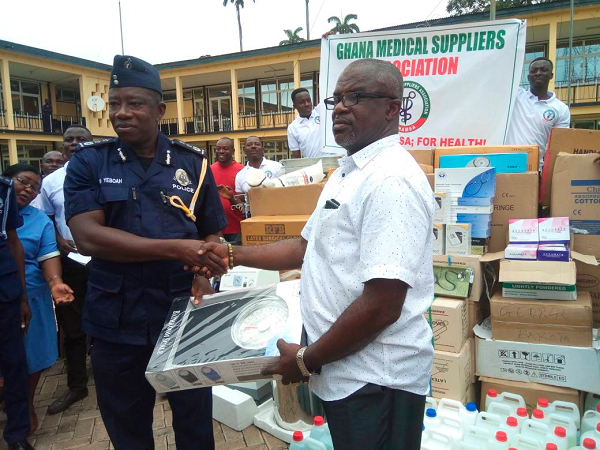 Nana Amoah Nyame (right) in a handshake with COP Mr Ken Yeboah, after presenting the instruments Nana Amoah Nyame (right) in a handshake with COP Mr Ken Yeboah, after presenting the instruments