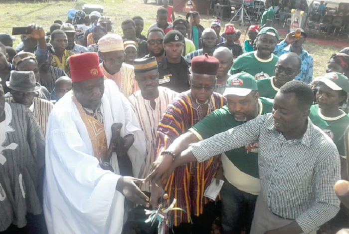 Mr Rockson Ayine Bukari (middle), Upper East Regional Minister, and Mr John Baptist Akado (right), Brands Manager, Eagle Larger, cutting the tape to inaugrate the project Mr Rockson Ayine Bukari (middle), Upper East Regional Minister, and Mr John Baptist Akado (right), Brands Manager, Eagle Larger, cutting the tape to inaugrate the project